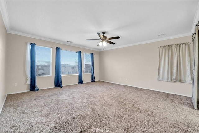 carpeted empty room featuring crown molding and ceiling fan