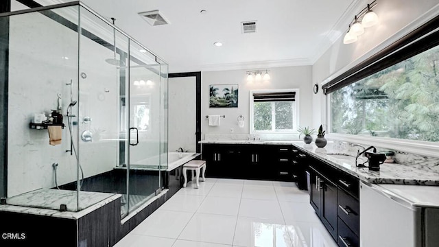 bathroom featuring vanity, crown molding, tile patterned floors, and shower with separate bathtub