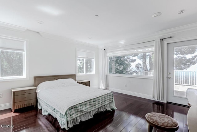 bedroom with dark hardwood / wood-style flooring, access to exterior, and crown molding