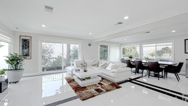 tiled living room featuring ornamental molding