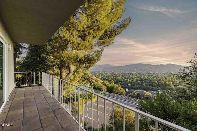 balcony at dusk with a mountain view