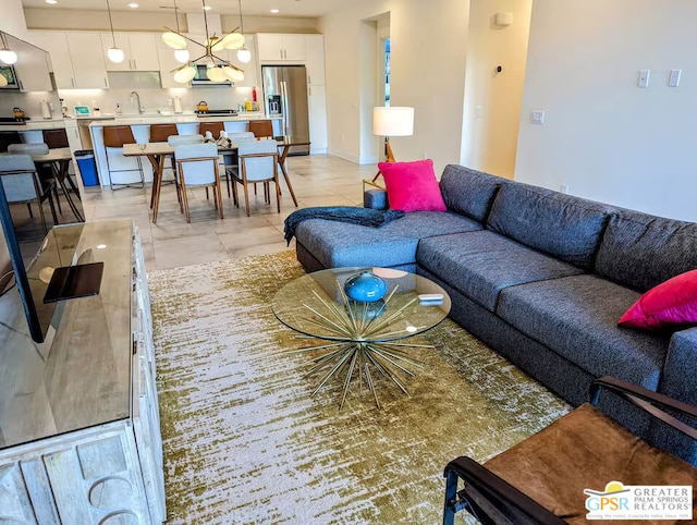 living room with sink and light tile patterned floors