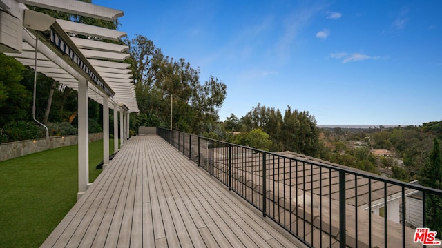 deck featuring a lawn