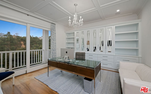 office featuring crown molding, coffered ceiling, a chandelier, and light hardwood / wood-style floors