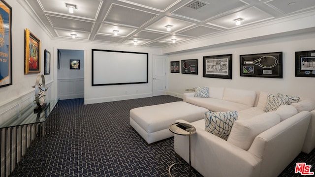 home theater featuring coffered ceiling and dark colored carpet