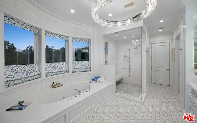 bathroom featuring vanity, tile patterned floors, ornamental molding, and separate shower and tub