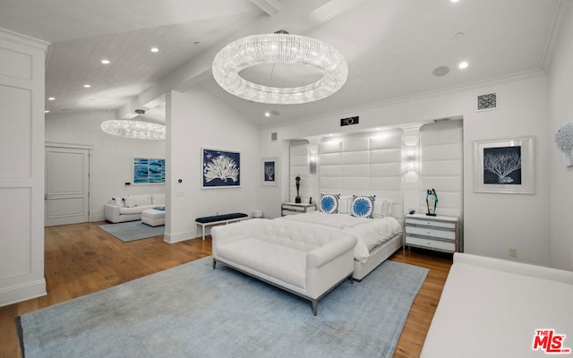 bedroom with hardwood / wood-style floors and vaulted ceiling with beams