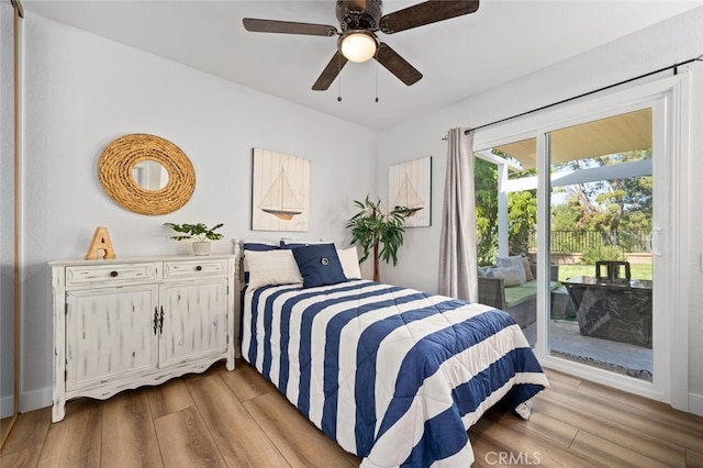 bedroom with access to exterior, ceiling fan, and light wood-type flooring