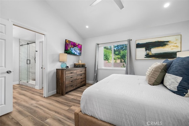 bedroom with hardwood / wood-style flooring, ceiling fan, and lofted ceiling