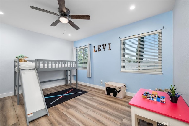 bedroom featuring wood-type flooring and ceiling fan