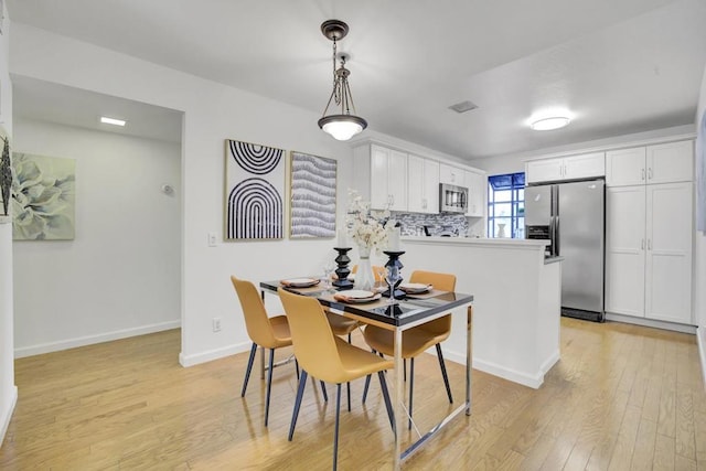 dining room featuring light wood-type flooring