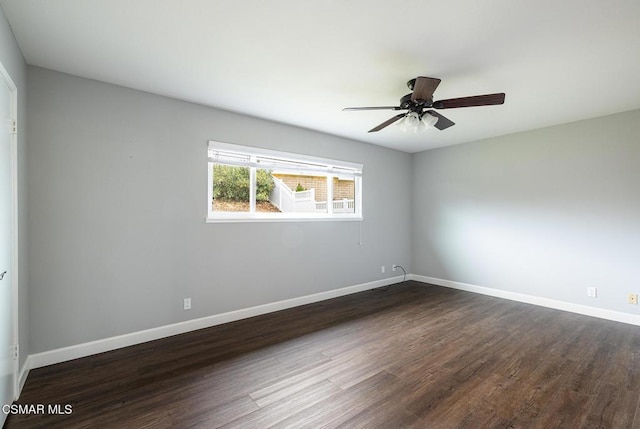 empty room with dark wood-type flooring and ceiling fan