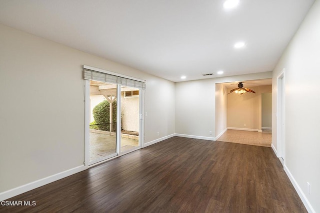 empty room with ceiling fan and wood-type flooring