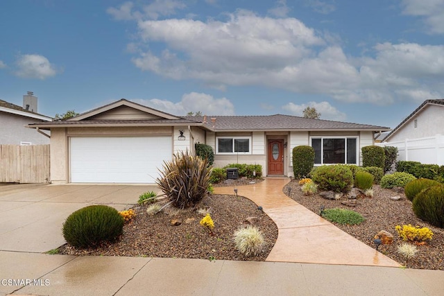 ranch-style home featuring a garage