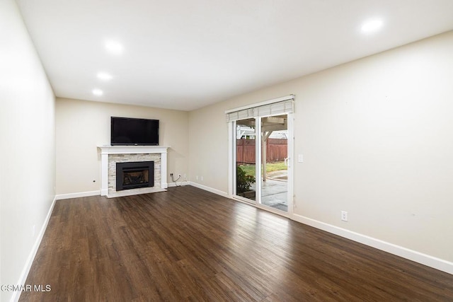 unfurnished living room featuring hardwood / wood-style floors and a fireplace