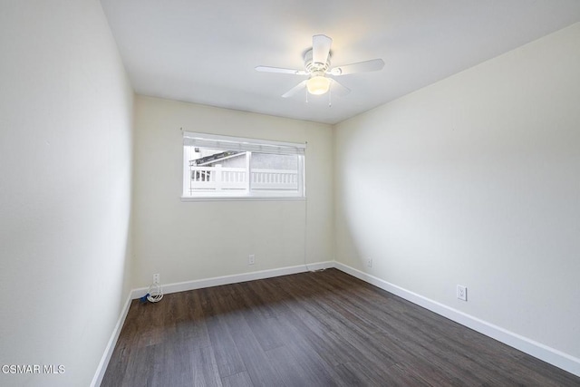 unfurnished room with ceiling fan and dark hardwood / wood-style floors