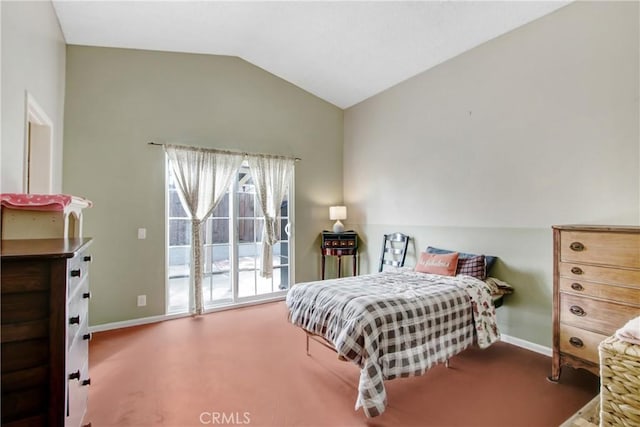 carpeted bedroom with lofted ceiling and access to exterior