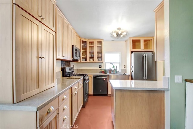 kitchen with stainless steel appliances, sink, and light brown cabinets