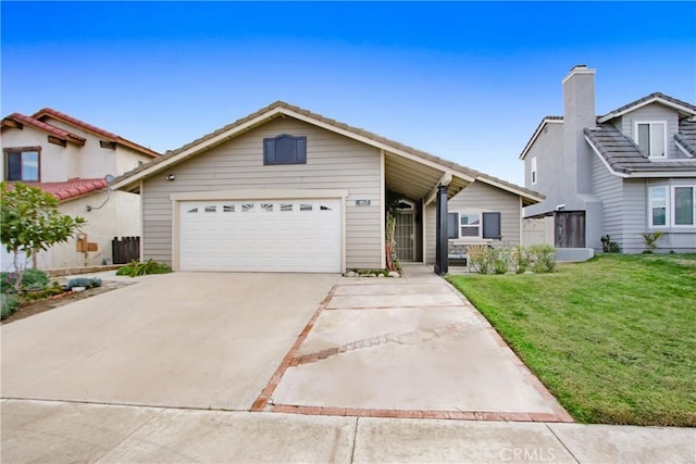 view of front of house featuring a garage and a front lawn