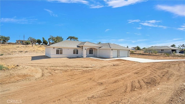 ranch-style home with a garage