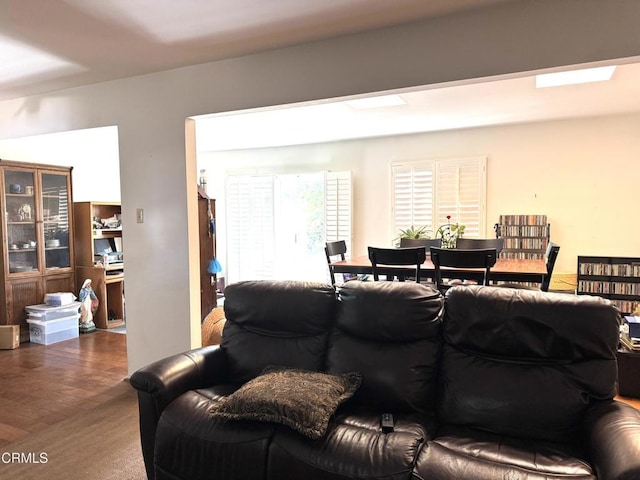 living room featuring a skylight