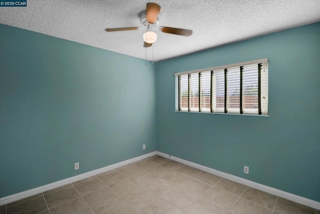 spare room featuring ceiling fan, a textured ceiling, and light tile patterned flooring