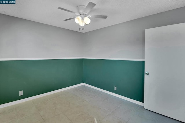 unfurnished room with a textured ceiling and ceiling fan