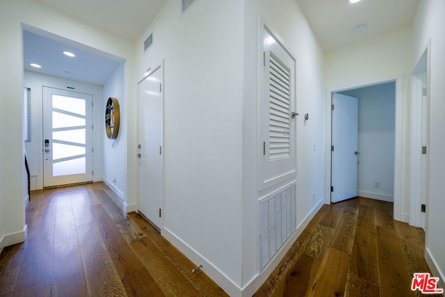 hall with dark hardwood / wood-style floors