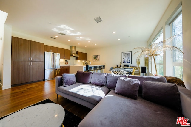 living room with dark hardwood / wood-style flooring