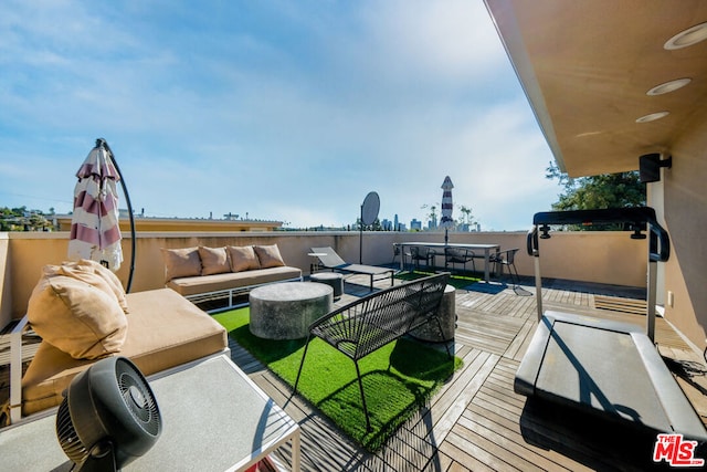 wooden deck with an outdoor hangout area