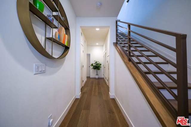 hall with dark wood-type flooring