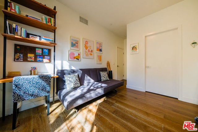 sitting room featuring hardwood / wood-style floors