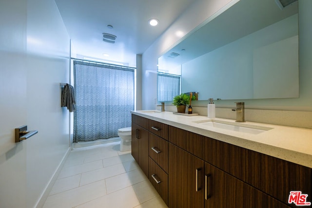 bathroom with vanity, an enclosed shower, tile patterned floors, and toilet