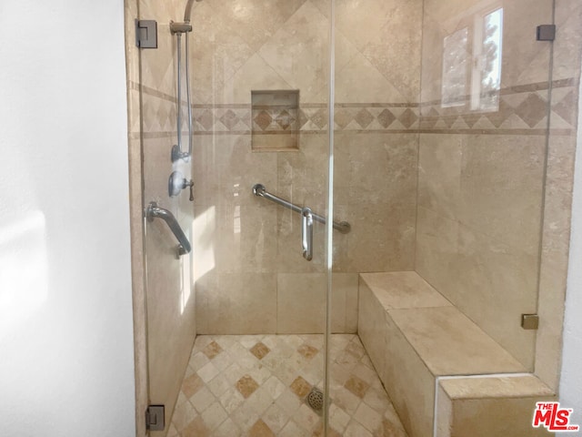 bathroom featuring an enclosed shower