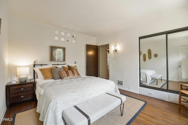 bedroom featuring hardwood / wood-style flooring and a closet