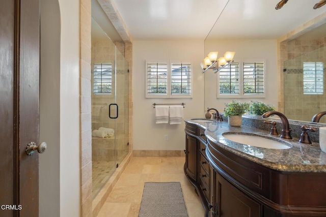 bathroom with vanity, a notable chandelier, tile patterned floors, and walk in shower