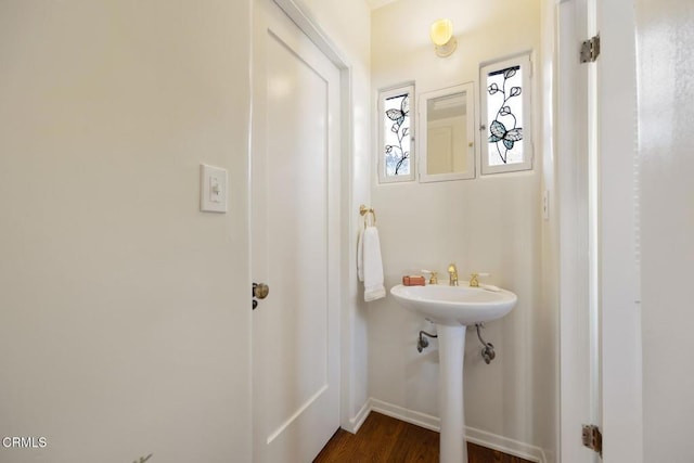 bathroom with hardwood / wood-style floors