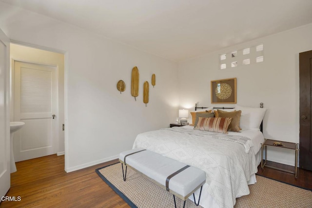 bedroom featuring wood-type flooring