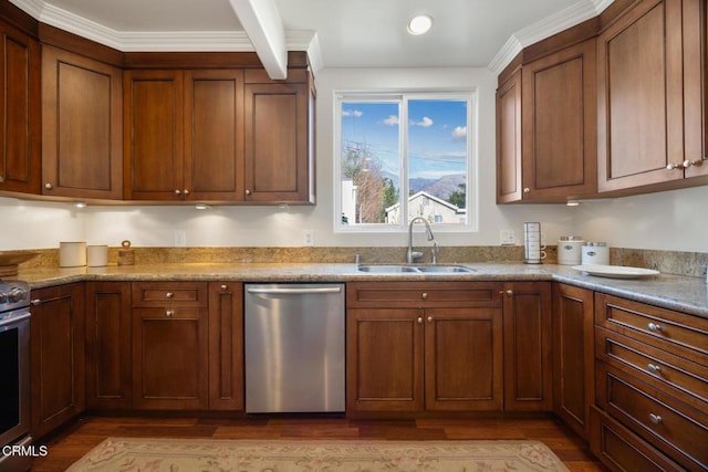 kitchen featuring dishwasher, sink, range, and light hardwood / wood-style floors