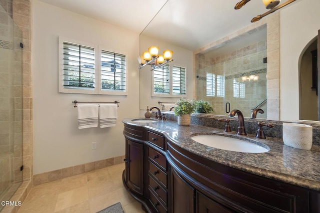 bathroom featuring vanity, a notable chandelier, tile patterned floors, and walk in shower