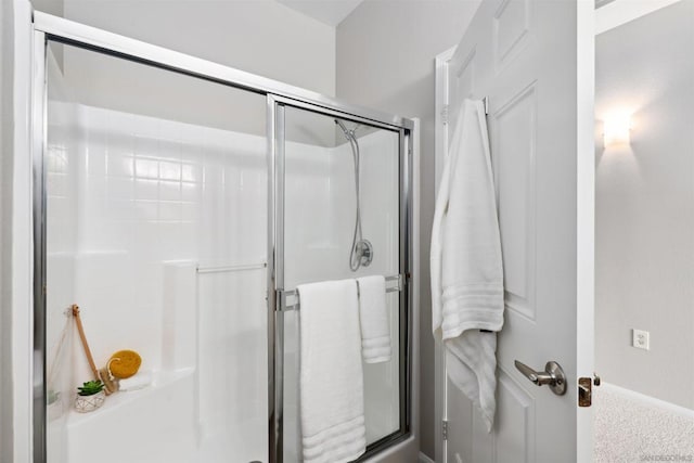 bathroom featuring an enclosed shower