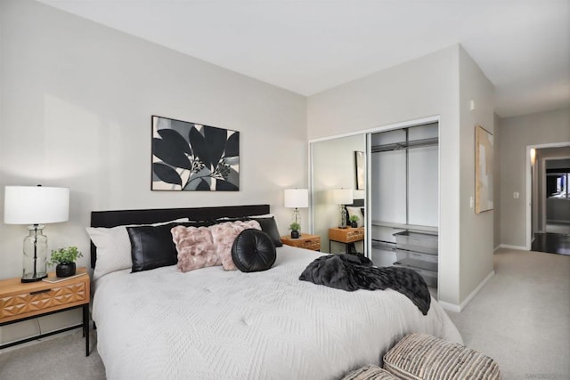 bedroom featuring light colored carpet and a closet