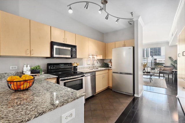 kitchen with sink, stainless steel appliances, light stone countertops, ornamental molding, and light brown cabinetry