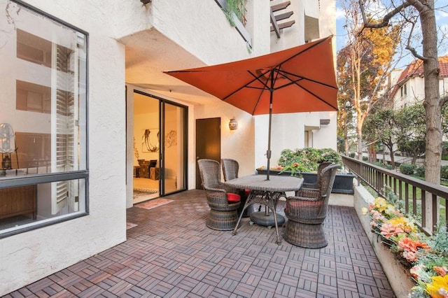 view of patio featuring a balcony