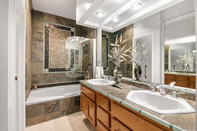 bathroom featuring vanity, shower with separate bathtub, and tile patterned flooring