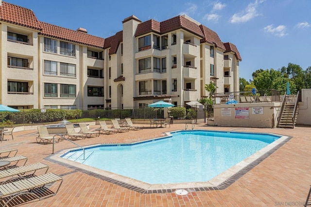 view of swimming pool featuring a patio