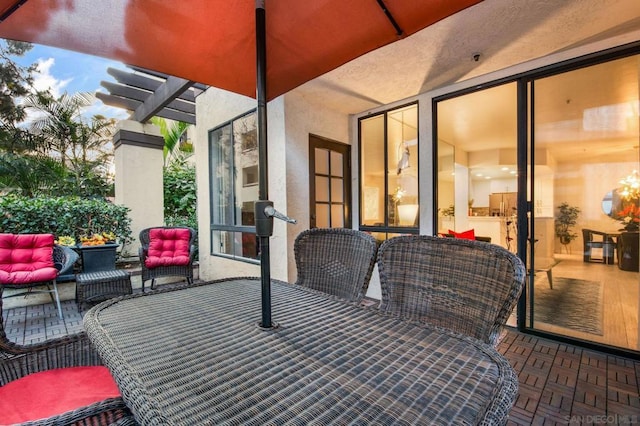 view of patio featuring an outdoor living space and a pergola