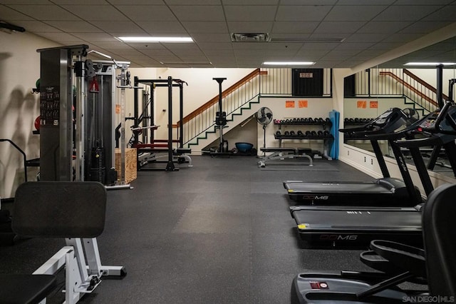 gym featuring a drop ceiling