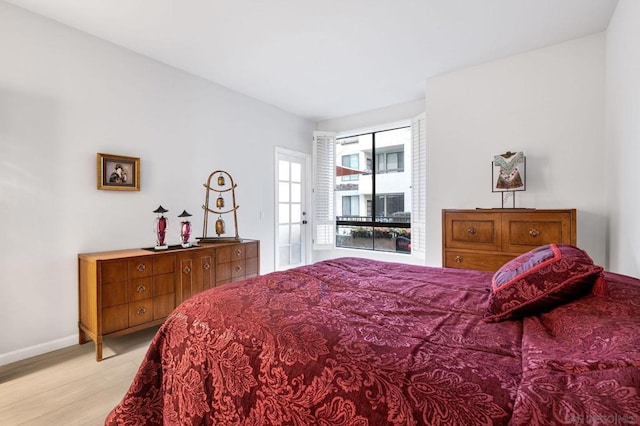 bedroom with light hardwood / wood-style floors