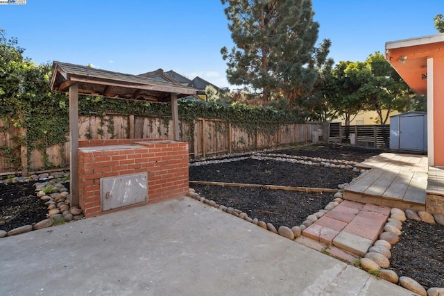 view of patio with a shed